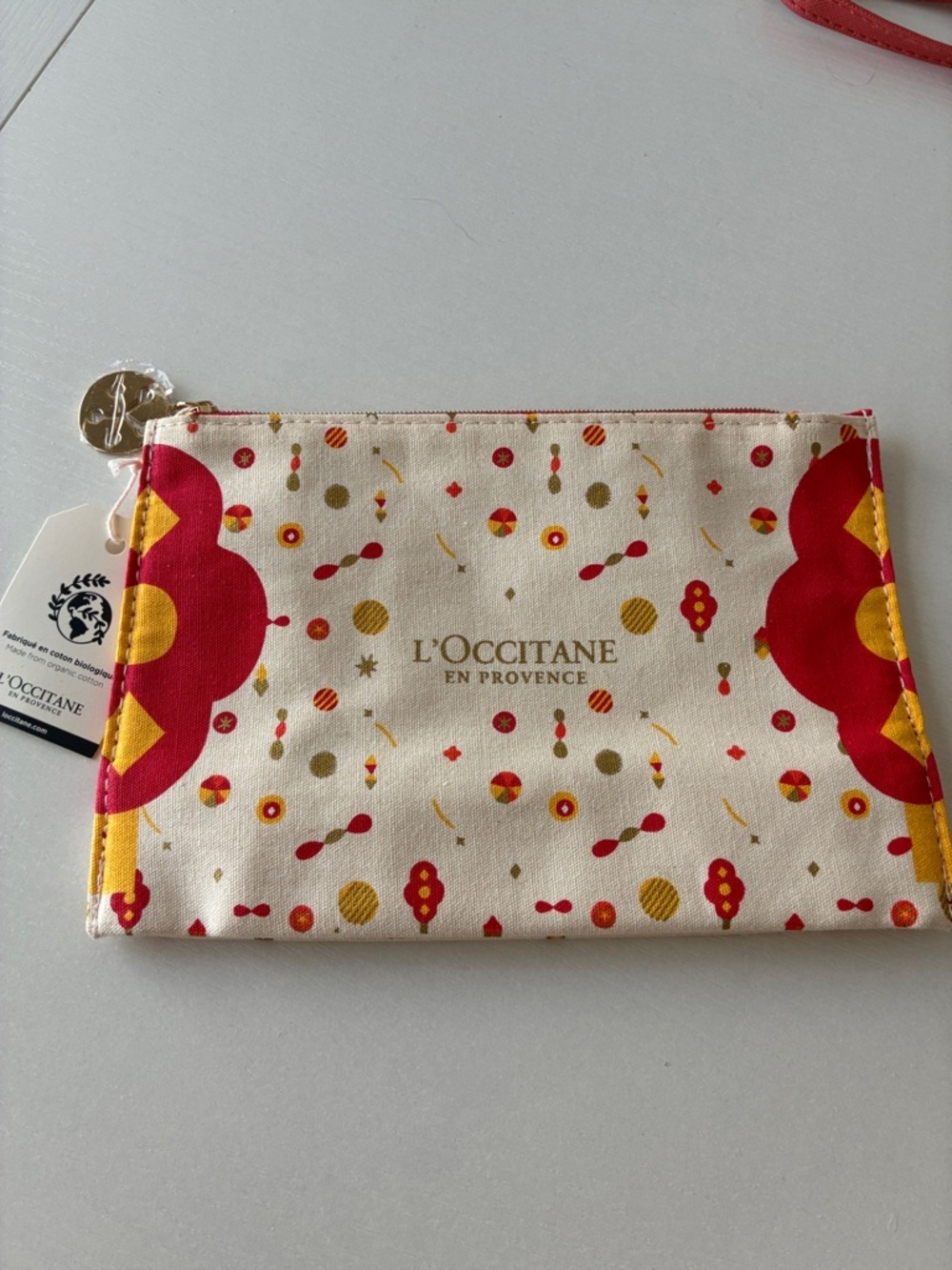 NWT L’OCCITANE Cream Cosmetic Pouch with Red & Yellow Motif